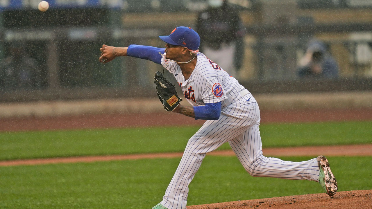 New York Mets starting pitcher Marcus Stroman throws in the rain against the Miami Marlins during the first inning of a baseball game at Citi Field. (Seth Wenig/AP)