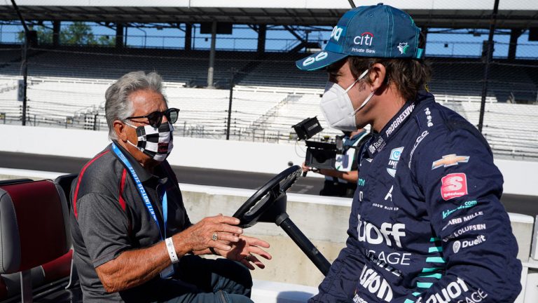 Mario Andretti, left, talks with Fernando Alonso, of Spain, before the final practice session for the Indianapolis 500 auto race at Indianapolis Motor Speedway. (Darron Cummings/AP)