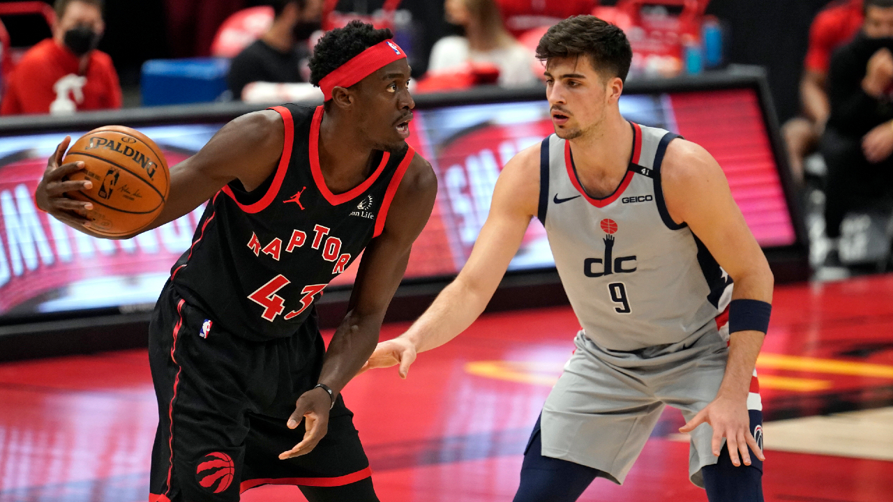 Toronto Raptors forward Pascal Siakam (43) looks to pass around Washington Wizards forward Deni Avdija (9) during the first half of an NBA basketball game Monday, April 5, 2021, in Tampa, Fla. (Chris O'Meara/AP)
