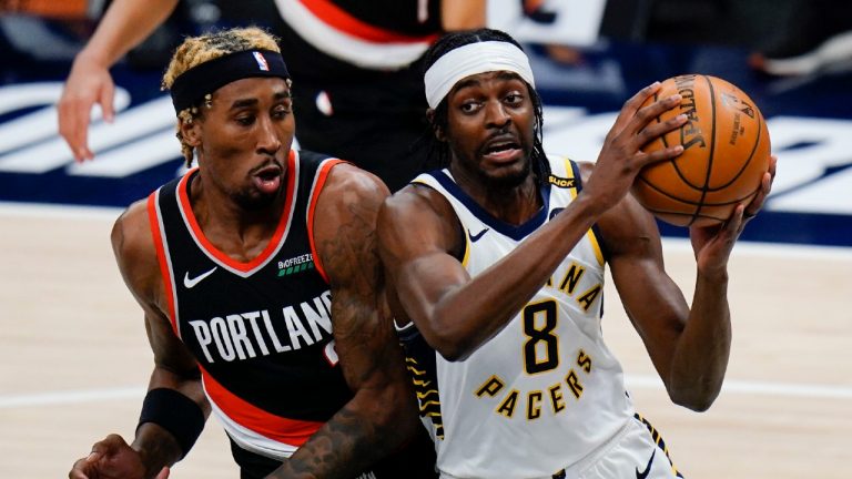 Indiana Pacers forward Justin Holiday (8) and Portland Trail Blazers forward Rondae Hollis-Jefferson. (AJ Mast/AP)