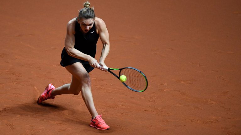 Romania's Simona Halep in action against Czech Republic's Marketa Vondrousova in their round of 16 women's singles match at the WTA tour in Stuttgart, Germany, Thursday, April 22, 2021. (Thomas Kienzle/dpa via AP)