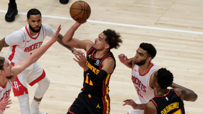Atlanta Hawks guard Trae Young (11) shoots against the Houston Rockets during the first half of an NBA basketball game on Sunday, May 16, 2021, in Atlanta. (AP Photo/Ben Gray)
