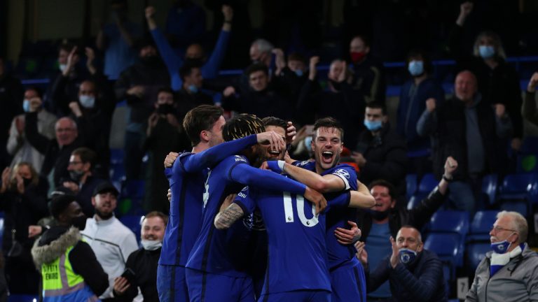 Chelsea's Jorginho celebrates with teammates after scoring his side's second goal from penalty during the English Premier League soccer match between Chelsea and Leicester City at Stamford Bridge Stadium in London, Tuesday, May 18, 2021. (Catherine Ivill/Pool via AP)