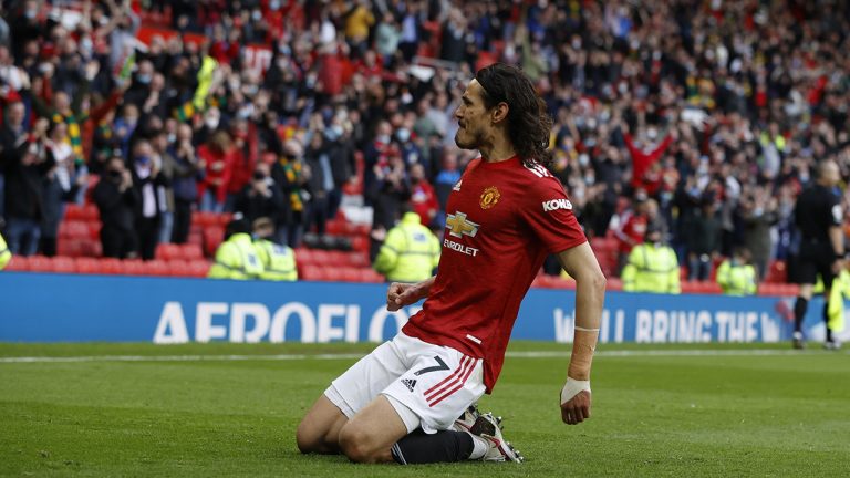 Manchester United's Edinson Cavani celebrates scoring their first goal during the English Premier League soccer match between Manchester United and Fulham at Old Trafford stadium in Manchester, England, Tuesday, May 18, 2021. (Phil Noble/AP)