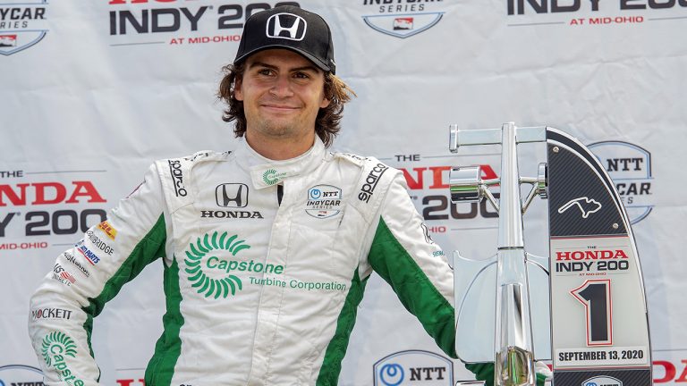 Colton Herta waits on the award stand after winning the IndyCar Series auto race, at Mid-Ohio Sports Car Course. (Phil Long/AP)