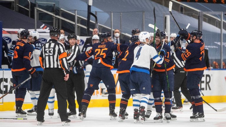 Edmonton Oilers and the Winnipeg Jets rough it up during first period NHL playoff action in Edmonton on Wednesday, May 19, 2021. (Jason Franson/CP)
