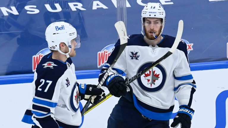 Winnipeg Jets left wing Nikolaj Ehlers (27) celebrates his goal against the Toronto Maple Leafs with teammate Pierre-Luc Dubois (13) during first period NHL action in Toronto on Thursday, March 11, 2021. (Frank Gunn / CP)