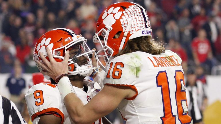 Former Clemson running back Travis Etienne, celebrates his touchdown with quarterback Trevor Lawrence during the second half of the team's Fiesta Bowl. (Ross D. Franklin/AP)