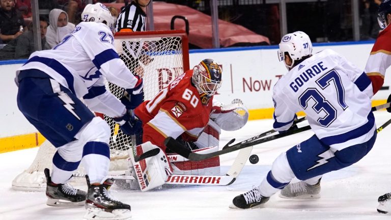 Florida Panthers goaltender Chris Driedger (60) defends against Tampa Bay Lightning defenseman Ryan McDonagh (27) and center Yanni Gourde (37) during the first period in Game 2 of an NHL hockey Stanley Cup first-round playoff series Tuesday, May 18, 2021, in Sunrise, Fla. (Lynne Sladky/AP)