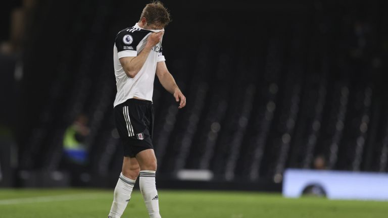 Dejected Fulham's Joachim Andersen walks on the field during a Premier League soccer match between Fulham and Burnley at the Craven Cottage Stadium in London, Monday, May 10, 2021. (Catherine Ivill/AP)