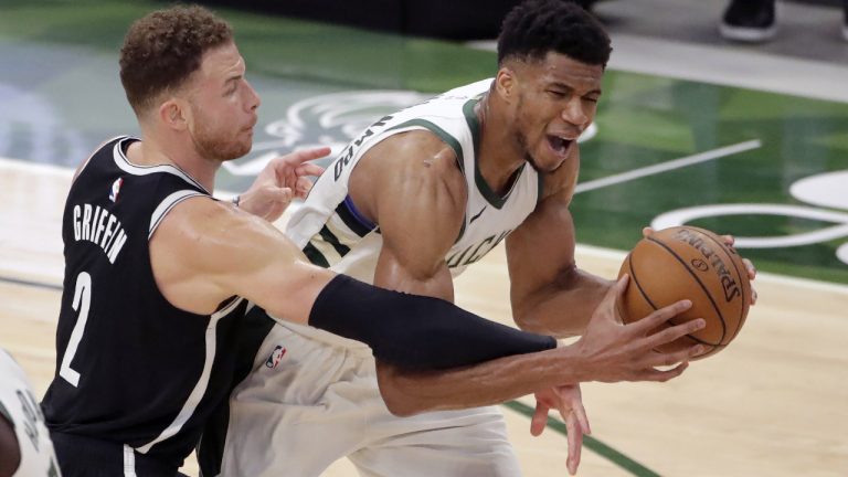 Milwaukee Bucks' Giannis Antetokounmpo is fouled by Brooklyn Nets' Blake Griffin during the second half of an NBA basketball game. (Aaron Gash/AP)