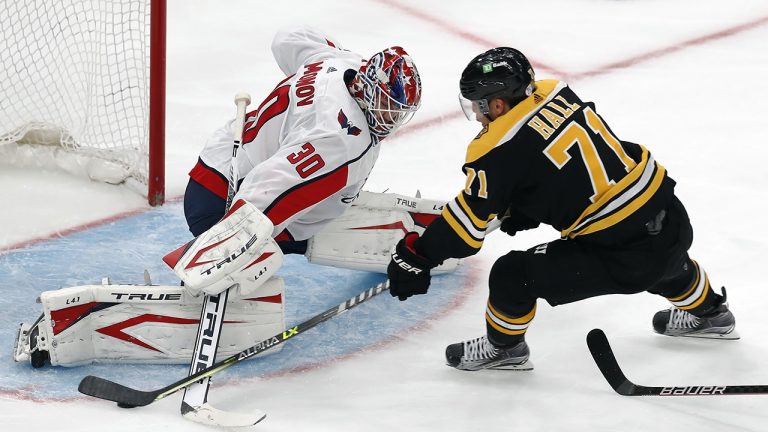 Washington Capitals' Ilya Samsonov (30) blocks a shot by Boston Bruins' Taylor Hall (71) during the second period in Game 4 of an NHL hockey Stanley Cup first-round playoff series Friday, May 21, 2021, in Boston. (AP Photo/Michael Dwyer)