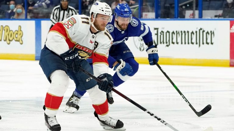 Florida Panthers left wing Jonathan Huberdeau (11) gets by Tampa Bay Lightning defenseman Erik Cernak (81) for a breakaway on goaltender Andrei Vasilevskiy during the first period of an NHL hockey game Thursday, April 15, 2021, in Tampa, Fla. (Chris O'Meara/AP)