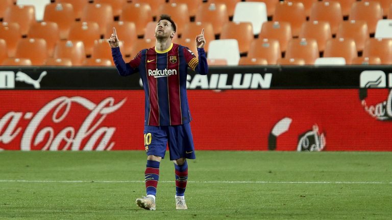 Barcelona's Lionel Messi celebrates scoring his side's 3rd goal during the Spanish La Liga soccer match between Valencia and Barcelona, Sunday, May 2, 2021. (Alberto Saiz/AP)