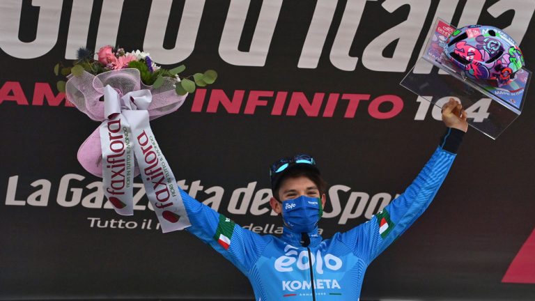 Italy's Lorenzo Fortunato celebrates on the podium after winning the 14th stage of the Giro D'Italia tour of Italy cycling race, from Cittadella to Monte Zoncolan. (Massimo Paolone/AP)