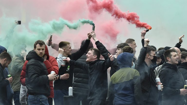 Manchester United fans protest outside the Lowry Hotel where team was staying during a protest against the Glazer family, owners of Manchester United, before their Premier League match against Liverpool at Old Trafford, Manchester, England, Sunday, May 2, 2021. (Rui Vieira/AP)
