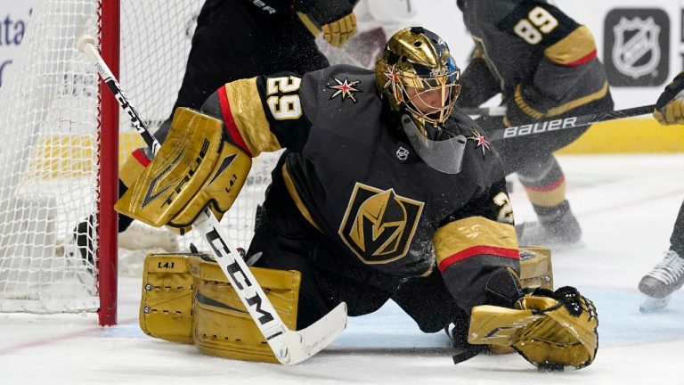 Vegas Golden Knights goaltender Marc-Andre Fleury makes a glove save of a shot against the Colorado Avalanche in the third period of an NHL hockey game Monday, Feb. 22, 2021, in Denver. (David Zalubowski/AP)