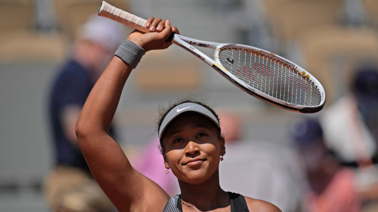 Japan's Naomi Osaka celebrates after defeating Romania's Patricia Maria Tig during their first round match of the French open tennis tournament at the Roland Garros stadium Sunday, May 30, 2021 in Paris. (Christophe Ena / AP)