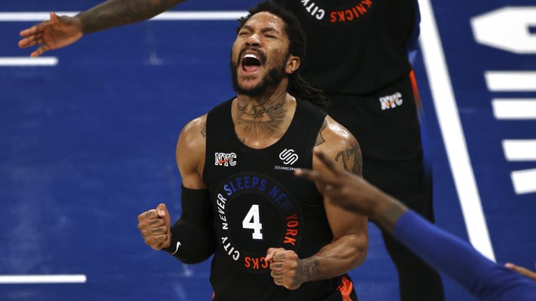 New York Knicks' Derrick Rose celebrates late in the fourth quarter. (Elsa/AP)