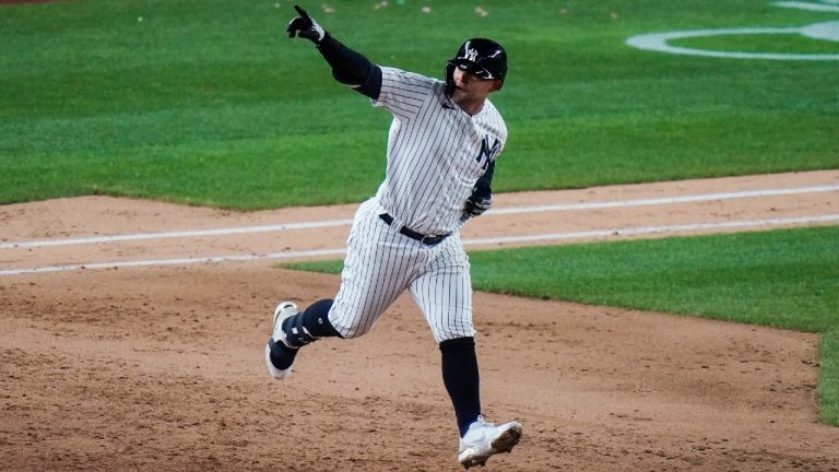 New York Yankees' Rougned Odor gestures to fans as he runs the bases after hitting a home run during the fifth inning of the team's baseball game against the Detroit Tigers on Friday, April 30, 2021, in New York. (Frank Franklin II/AP)