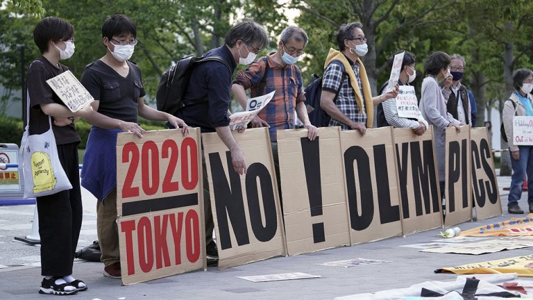 People against the Tokyo 2020 Olympics set to open in July, protest around Tokyo's National Stadium during an anti-Olympics demonstration. (Eugene Hoshiko/AP)