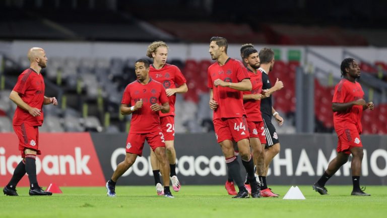 Players of Toronto FC warm up prior to a CONCACAF Champions League quarterfinal second leg soccer match against Cruz Azul, at Azteca stadium in Mexico City, Tuesday, May 4, 2021. (Fernando Llano/AP)