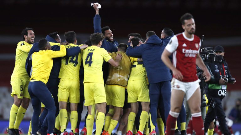 Villarreal players celebrate at the end of the Europa League semifinal second leg soccer match between Arsenal and Villarreal. (Alastair Grant/AP)
