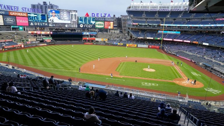 Socially distanced fans watch during the first inning of a baseball game between the New York Yankees and the Tampa Bay Rays at Yankee Stadium on Friday, April 16, 2021, in New York. (Frank Franklin II/AP)