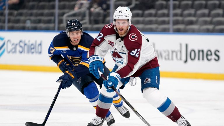 Colorado Avalanche's Gabriel Landeskog (92) handles the puck as St. Louis Blues' Jaden Schwartz (17) defends during the third period of an NHL hockey game. (Jeff Roberson/AP)