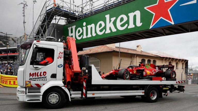 The car of Ferrari driver Charles Leclerc of Monaco is taken off the track after a crash during the qualifying session at the Monaco racetrack. (Luca Bruno/AP)
