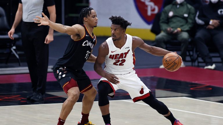 Miami Heat's Jimmy Butler (22) looks to drive against Cleveland Cavaliers' Isaac Okoro (35) during the first half of an NBA basketball game, Saturday, May 1, 2021, in Cleveland. (Ron Schwane/AP)