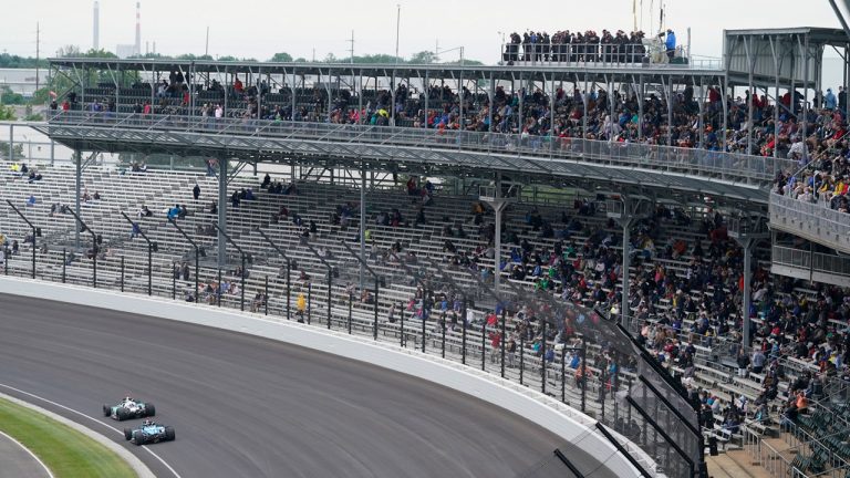 Fans watch during the final practice session for the Indianapolis 500 auto race at Indianapolis Motor Speedway. (Darron Cummings/AP)