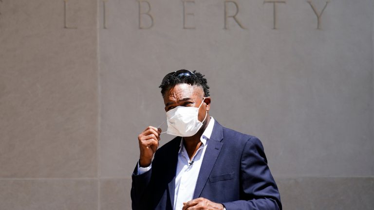Former NFL player Ken Jenkins exits the building after delivering tens of thousands of petitions demanding equal treatment for everyone involved in the settlement of concussion claims against the NFL, to the federal courthouse in Philadelphia, Friday, May 14, 2021. (Matt Rourke/AP)