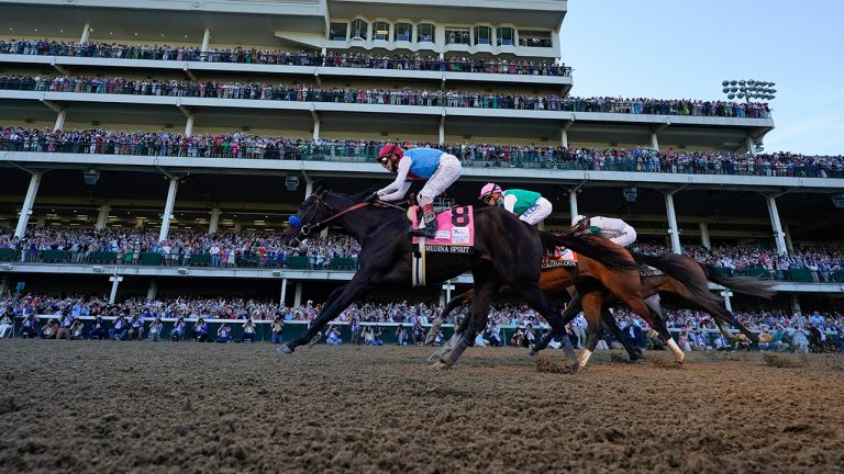 John Velazquez riding Medina Spirit leads Florent Geroux on Mandaloun and Flavien Prat riding Hot Rod Charlie to win the 147th running of the Kentucky Derby at Churchill Downs, Saturday, May 1, 2021, in Louisville, Ky. (Jeff Roberson/AP)