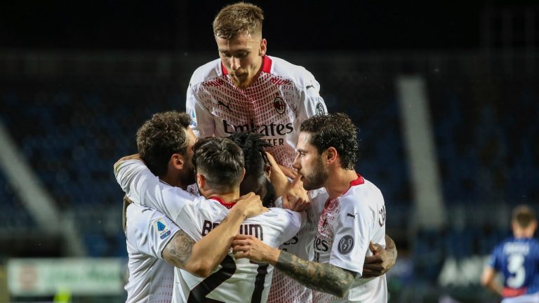 AC Milan's Franck Kessie, centre, celebrates with teammates after scoring his side's opening goal, during the Serie A soccer match between Atalanta and AC Milan, at the Gewiss stadium in Bergamo, Italy, Sunday, May 23, 2021. (Stefano Nicoli/LaPresse via AP)