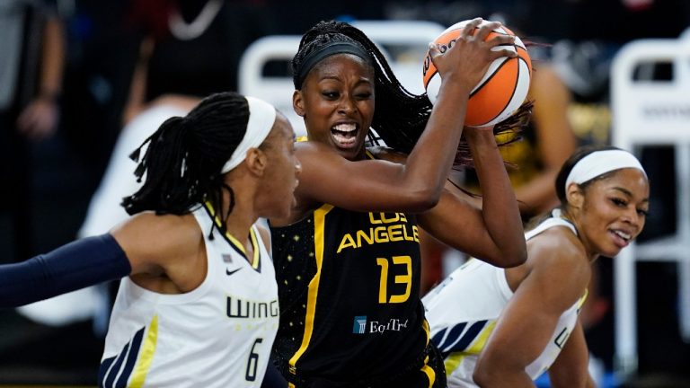 Los Angeles Sparks forward Chiney Ogwumike (13) controls the ball against Dallas Wings forward Kayla Thornton (6) and forward Charli Collier, right, during the first quarter of a WBNA basketball game Friday, May 14, 2021, in Los Angeles. (Ashley Landis/AP)
