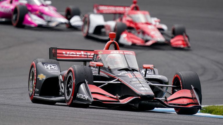 Will Power of Australia drives through a turn during the IndyCar auto race. (Michael Conroy/AP)