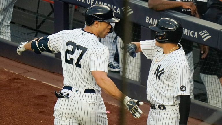 New York Yankees' Giancarlo Stanton, left, celebrates with teammate Gio Urshela after hitting a two-run home run during the first inning of a baseball game against the Houston Astros. (Frank Franklin II/AP)