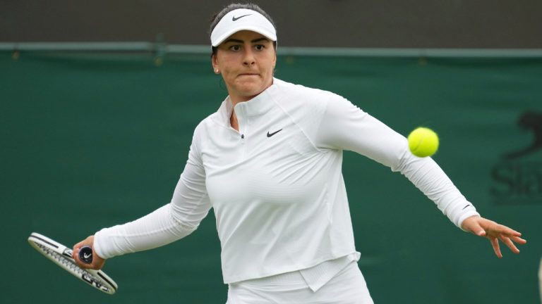 Canada's Bianca Andreescu plays a return to Alize Cornet of France during the women's singles first round match at Wimbledon. (Alberto Pezzali/AP)