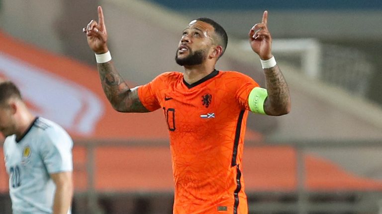Netherlands' Memphis Depay, celebrates after scoring his side's second goal during the international friendly soccer match between the Netherlands and Scotland at the Algarve stadium outside Faro, Portugal, Wednesday June 2, 2021. (Miguel Morenatti/AP)