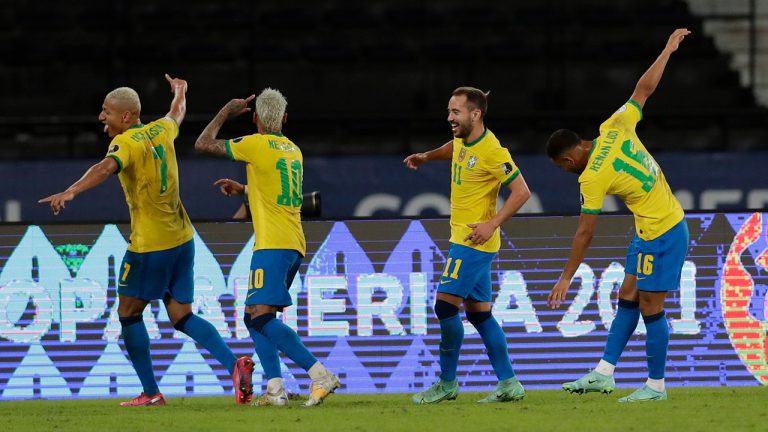 Brazil's Richarlison, left, celebrates with teammates after scoring his side's 4th goal during a Copa America soccer match against Peru at Nilton Santos stadium in Rio de Janeiro, Brazil, Thursday, June 17, 2021. (Silvia Izquierdo/AP)