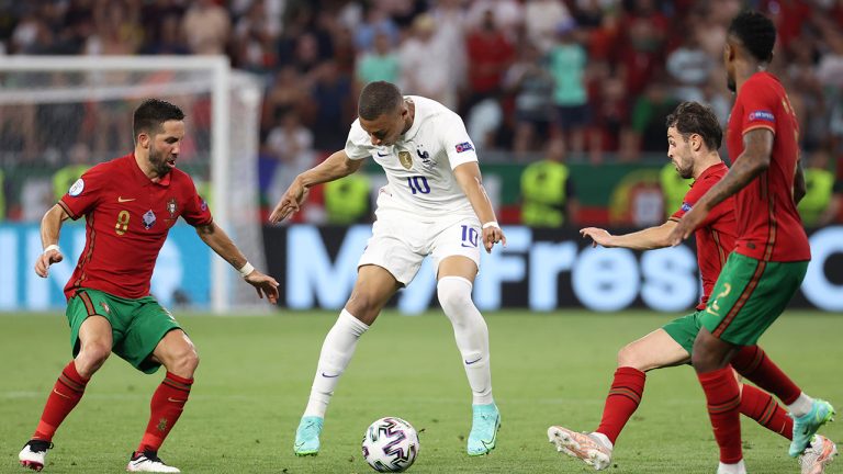 France's Kylian Mbappe, centre, controls the ball during the Euro 2020 Group F match between Portugal and France at the Puskas Arena in Budapest, Wednesday, June 23, 2021. (Bernadett Szabo, Pool photo via AP) 