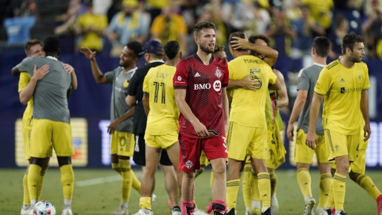 Toronto FC defender Eriq Zavaleta, center, leaves the pitch as Nashville SC players celebrate after an MLS soccer match Wednesday, June 23, 2021, in Nashville, Tenn. Nashville SC won 3-2. (Mark Humphrey/AP)