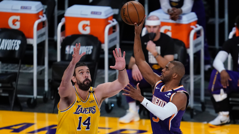 Los Angeles Lakers center Marc Gasol (14) defends against Phoenix Suns guard Chris Paul (3) during the first quarter of Game 6 of an NBA basketball first-round playoff series Thursday, Jun 3, 2021, in Los Angeles. (Ashley Landis / AP) 