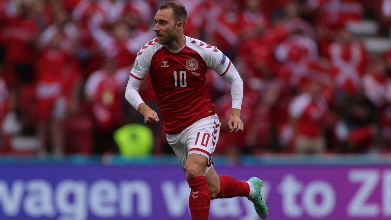 Denmark's Christian Eriksen runs during the Euro 2020 match between Denmark and Finland at Parken stadium in Copenhagen, Denmark, Saturday, June 12, 2021. (Wolfgang Rattay/Pool via AP)