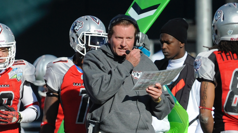In this Nov. 27, 2010, file photo, then Las Vegas head coach Jim Fassel, center, looks on from the sideline during their United Football League title game against Florida in Omaha, Neb. (Dave Weaver / AP)