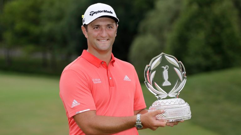 Jon Rahm poses with the trophy after winning the Memorial golf tournament, Sunday, July 19, 2020. (Darron Cummings/AP)