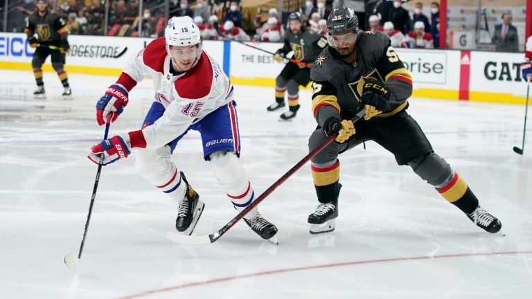 Montreal Canadiens center Jesperi Kotkaniemi (15) and Vegas Golden Knights right wing Keegan Kolesar (55) reach for the puck. (John Locher/AP)