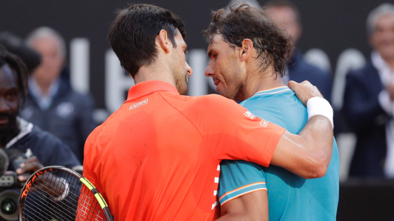 Rafael Nadal, right, of Spain embraces Novak Djokovic of Serbia at the end of their final match at the Italian Open tennis tournament, in Rome, Sunday, May 19, 2019. (Gregorio Borgia / AP)