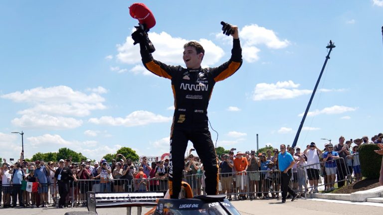 Pato O'Ward celebrates after winning the second race of the IndyCar Detroit Grand Prix auto racing doubleheader on Belle Isle in Detroit, Sunday, June 13, 2021. (Paul Sancya/AP)
